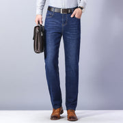 Men’s Straight-Leg Denim Jeans – Mid Waist Casual Washed Trousers for showcased in a stylish outfit with a briefcase.